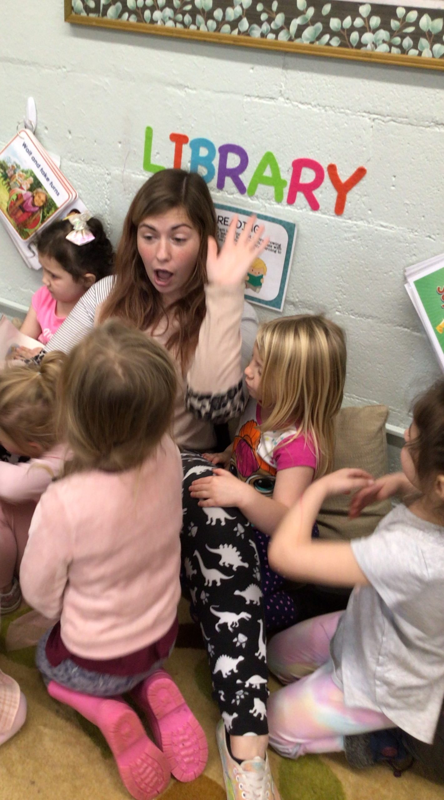 teach and students in library corner