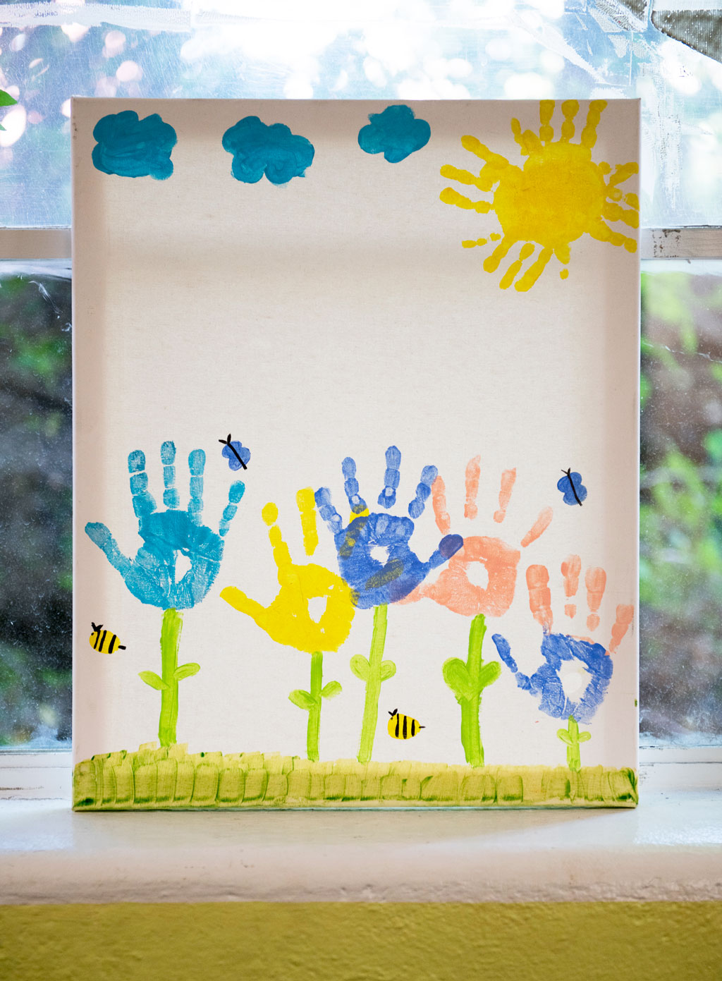 child art work of hands creating trees